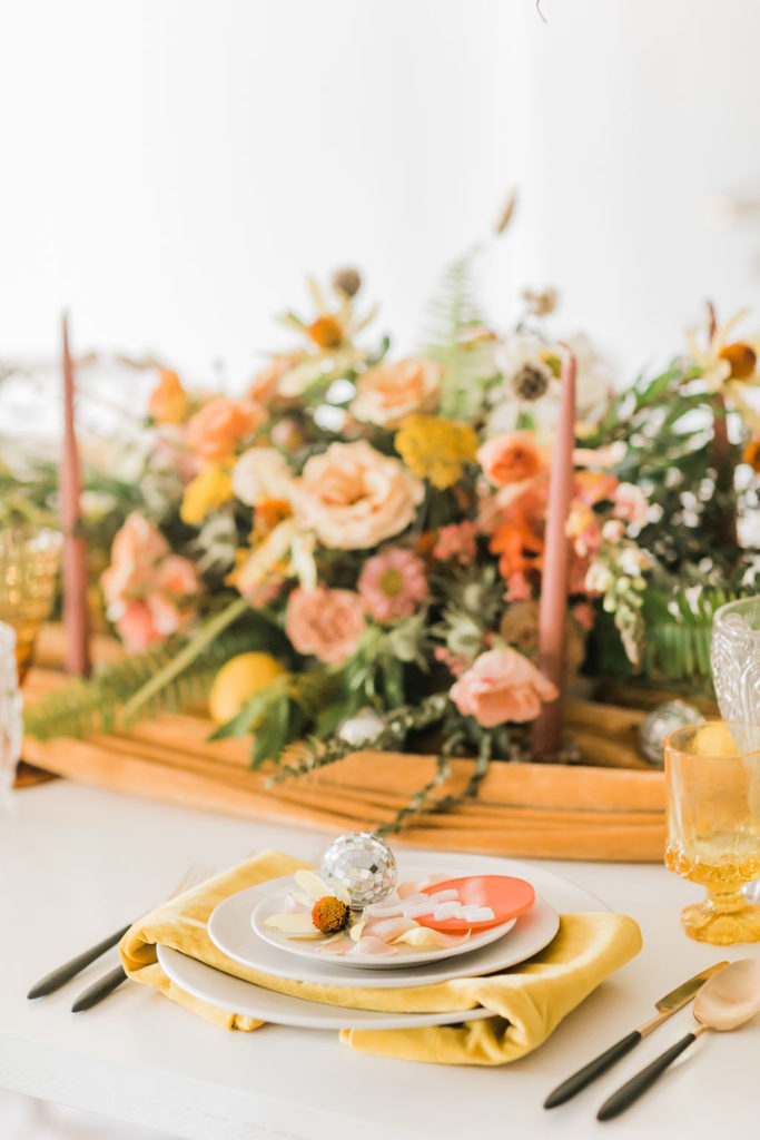 Spring Fever inspired styled shoot at La Piñata + Feathered Arrow Events using orange, pink and yellow in your wedding, hanging floral installation and wildflower centerpiece