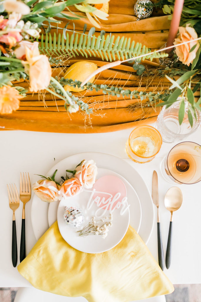 Spring Fever inspired styled shoot at La Piñata + Feathered Arrow Events using orange, pink and yellow in your wedding, wildflower centerpiece