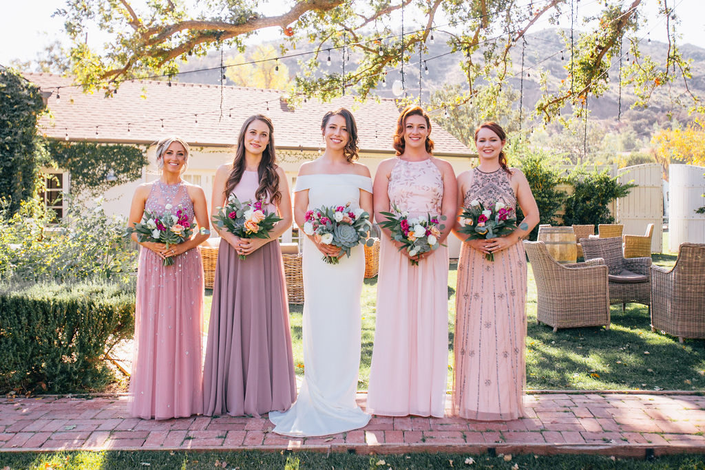 Fall Wedding at Triunfo Creek Vineyards, bride and bridal party portrait, blush and purple bridesmaid dresses