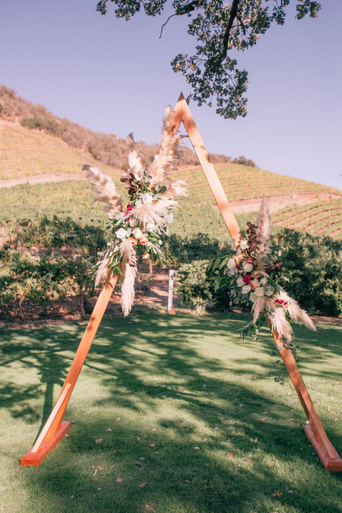 Fall Wedding ceremony at Triunfo Creek Vineyards, A shaped ceremonial arch