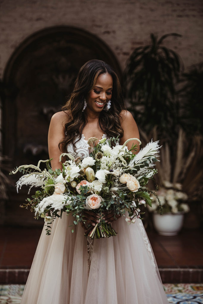 A romantic wedding at Ebell Long Beach, large hand tied bridal bouquet
