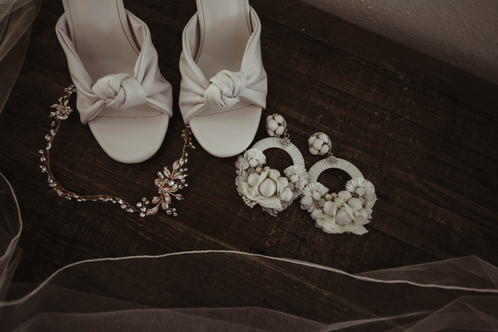 A romantic wedding at Ebell Long Beach, bride detail shot, white bridal shoes