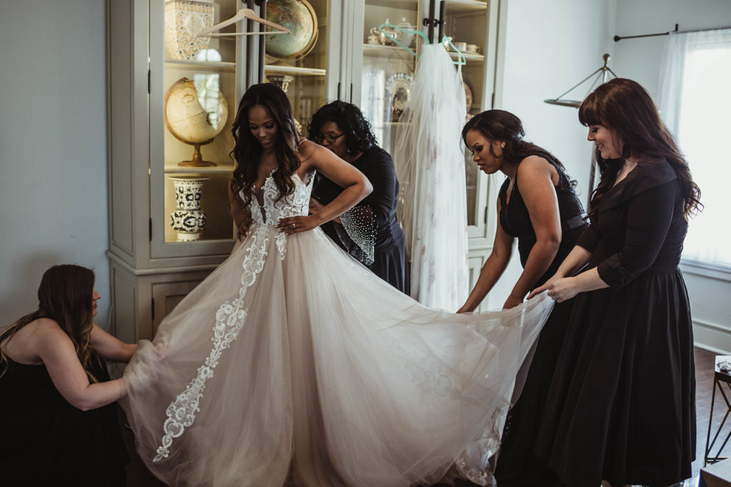 A romantic wedding at Ebell Long Beach, bride getting ready with bridesmaids