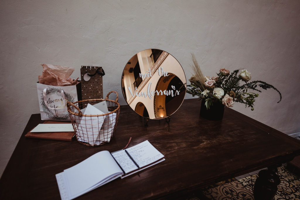 A romantic wedding ceremony at Ebell Long Beach, welcome table with mirror sign