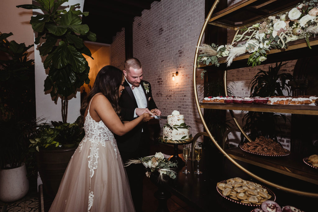 A romantic wedding reception at Ebell Long Beach, cake cutting