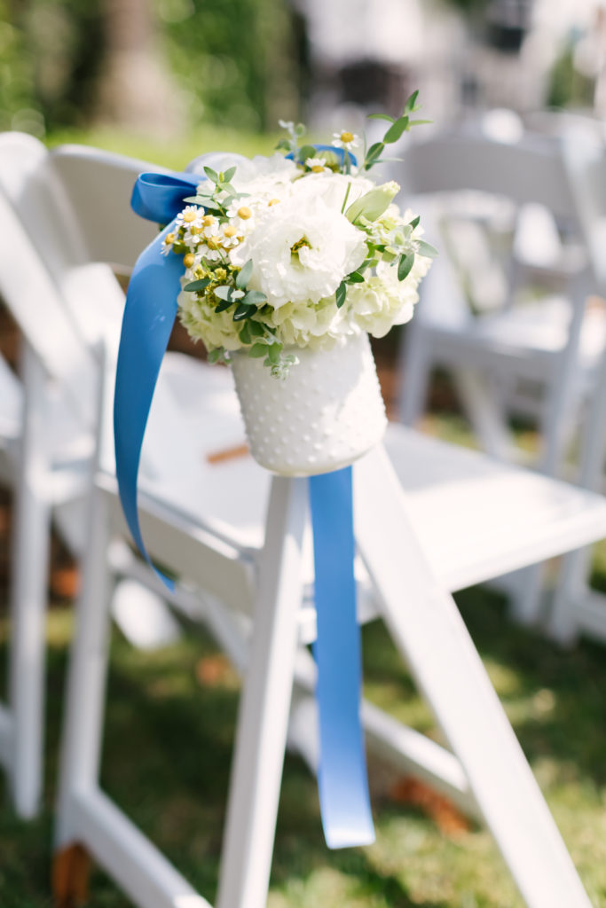 An Al Fresco Wedding ceremony at the Valley Hunt club, ceremony aisle flowers