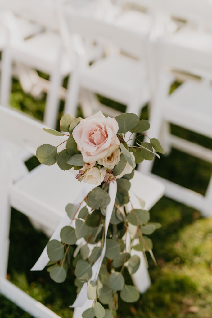 A music festival themed wedding ceremony at The Inn at Rancho Santa Fe, rose aisle flowers