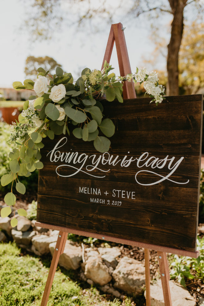 A music festival themed wedding ceremony at The Inn at Rancho Santa Fe, welcome sign calligraphy