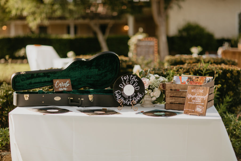 A music festival themed wedding ceremony at The Inn at Rancho Santa Fe, welcome table with record guest book