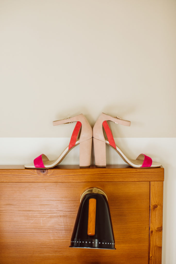 A unique and colorful wedding at the Grass Room in downtown Los Angeles, red wedding shoes