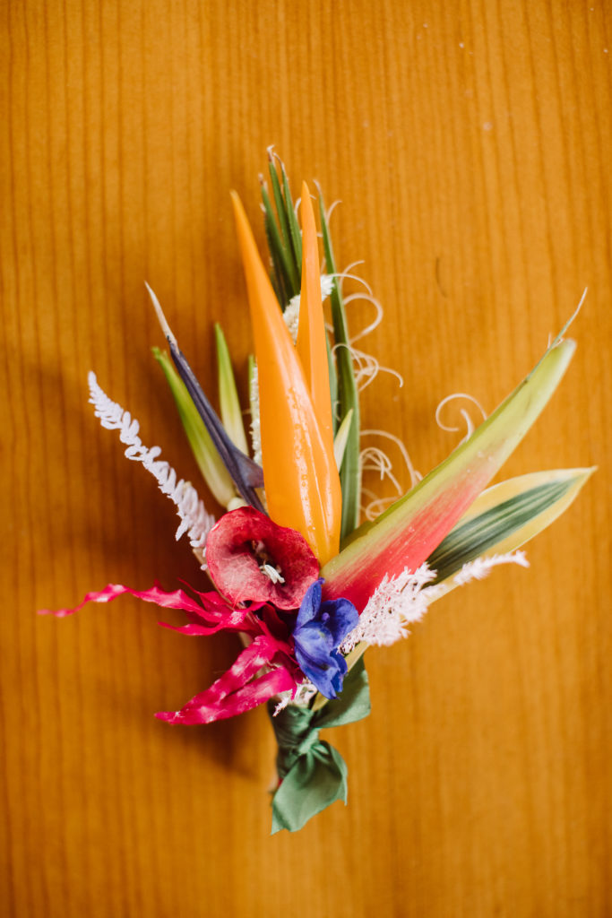 A unique and colorful wedding at the Grass Room in downtown Los Angeles, bright and eclectic groom boutonniere