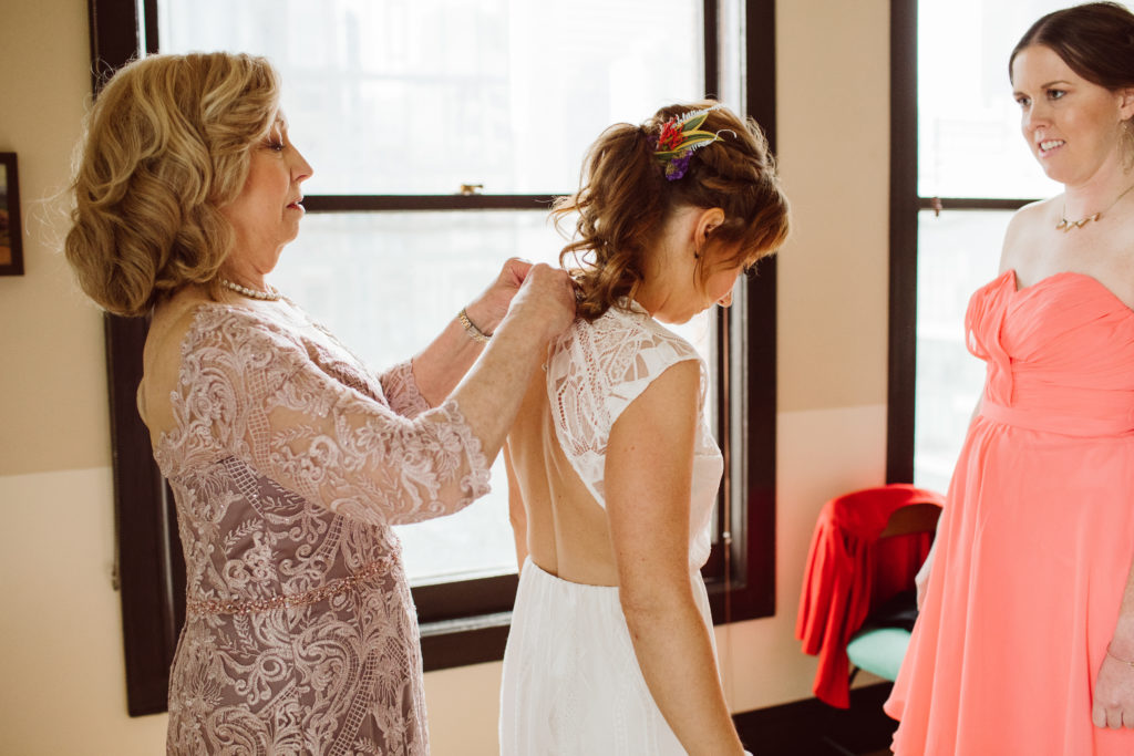 A unique and colorful wedding at the Grass Room in downtown Los Angeles, bride getting ready with mother