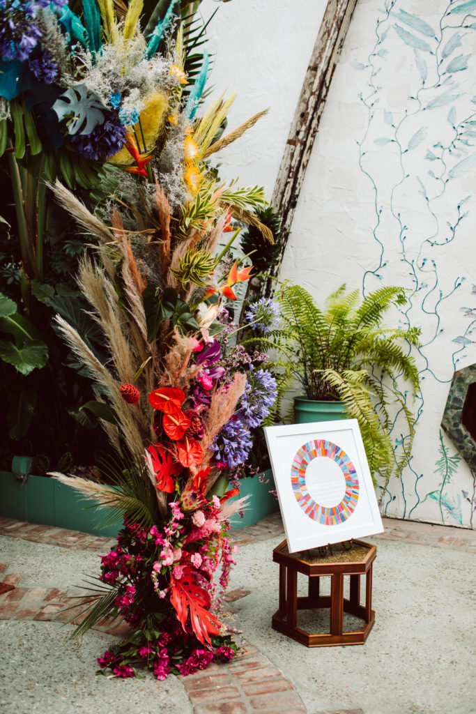A unique and colorful wedding ceremony at the Grass Room in downtown Los Angeles, eclectic rainbow inspired chuppah