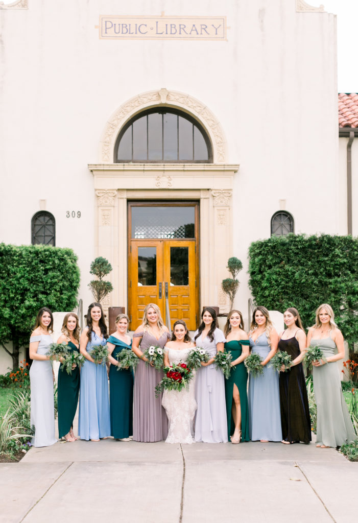 An ocean view wedding ceremony at The Redondo Beach Historic Library, bride and bridesmaids in mismatching dresses
