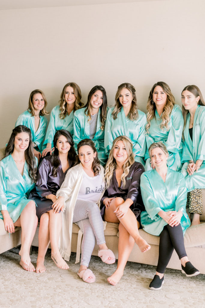 An ocean view wedding ceremony at The Redondo Beach Historic Library, bride getting ready with bridesmaids in teal robes