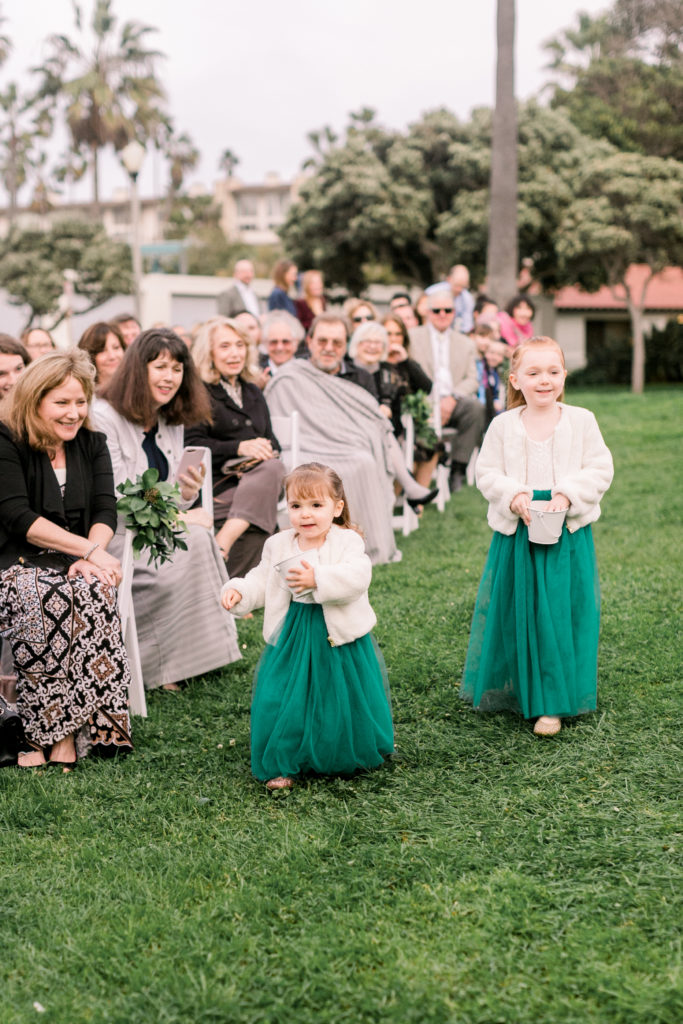 An ocean view wedding ceremony at The Redondo Beach Historic Library, flower girls in green dresses