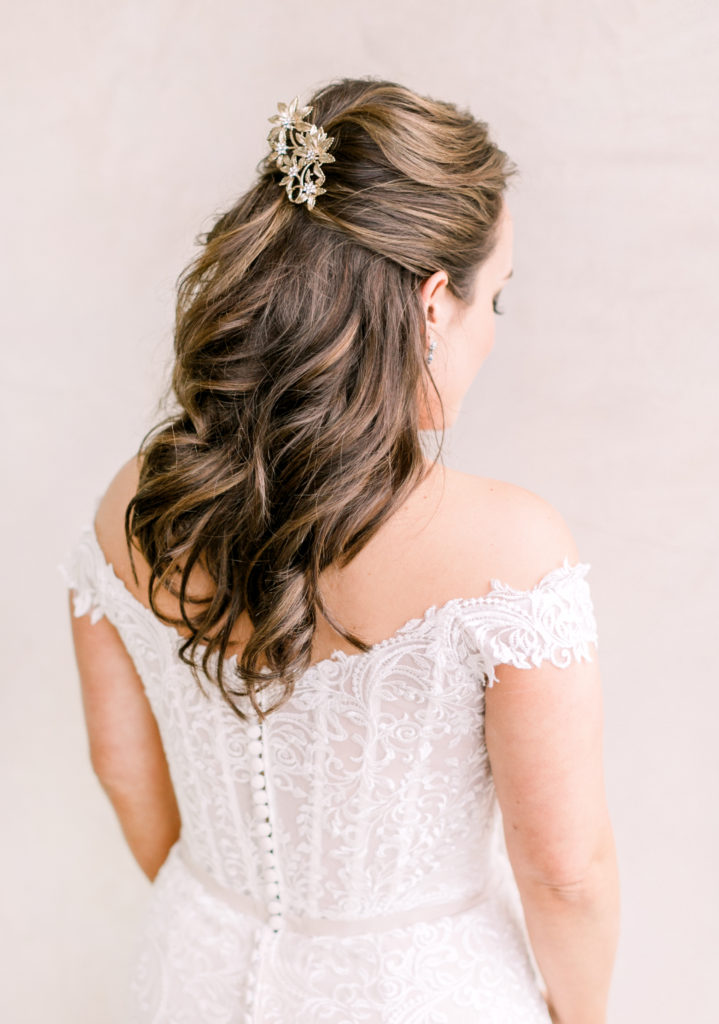 An ocean view wedding ceremony at The Redondo Beach Historic Library, bride with half up hair and crystal hair pin