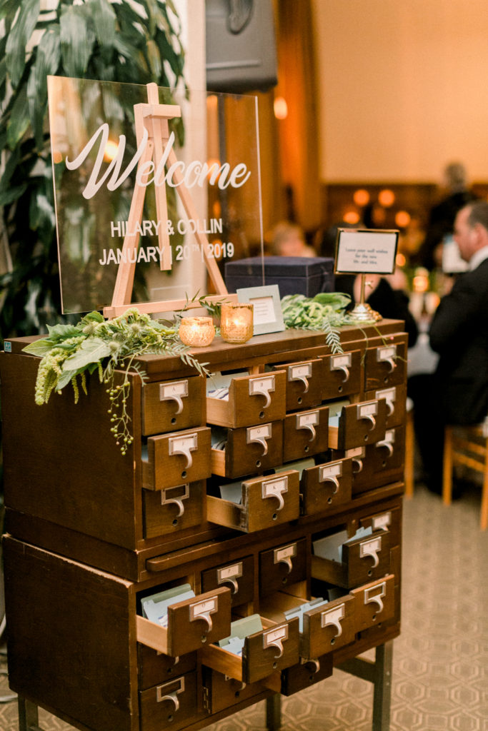 An ocean view wedding ceremony at The Redondo Beach Historic Library, wedding reception with library filing cabinet for escort cards