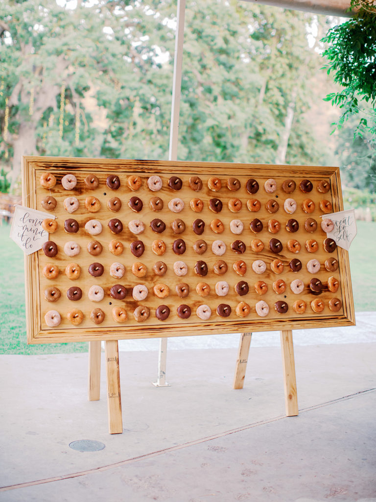 A colorful and vibrant wedding at Triunfo Creek Vineyards, giant donut wall 
