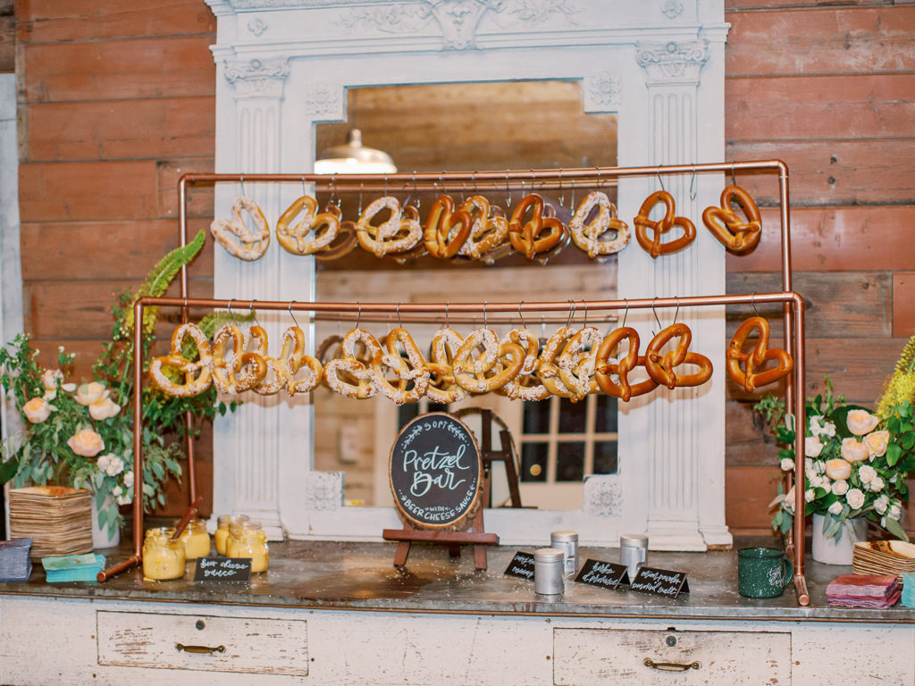 A colorful and vibrant wedding at Triunfo Creek Vineyards, pretzel bar
