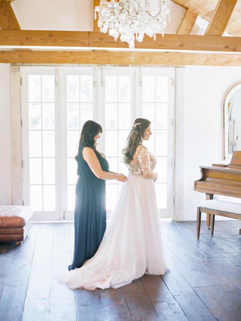 A colorful and vibrant wedding at Triunfo Creek Vineyards, bride getting ready with mom