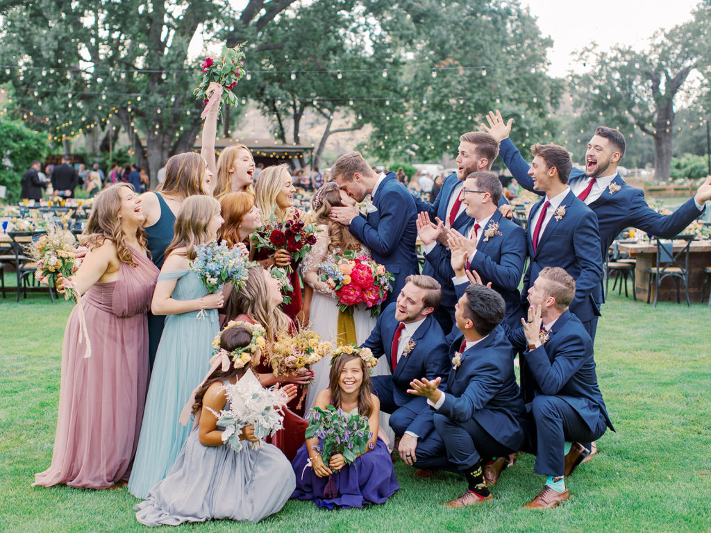 A colorful and vibrant wedding ceremony at Triunfo Creek Vineyards, wedding party photo
