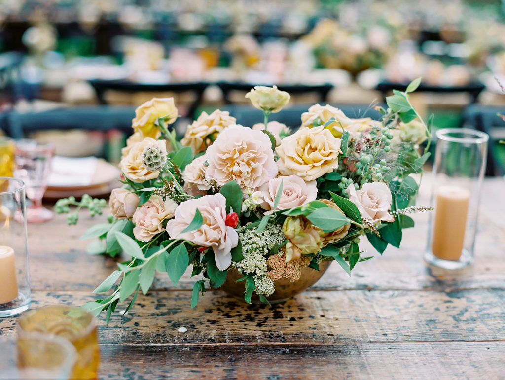 A colorful and vibrant wedding reception at Triunfo Creek Vineyards, pink and yellow table set up