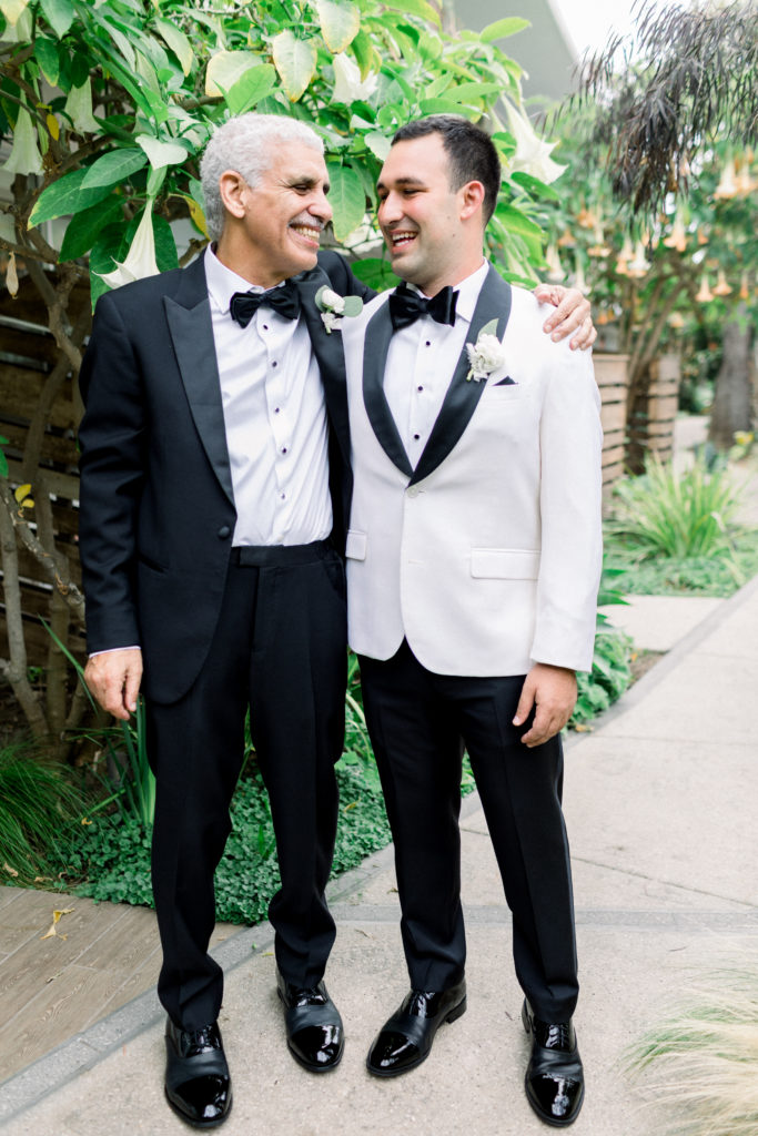 A classic greenhouse wedding at Dos Pueblos Orchid Farm, groom in white tux