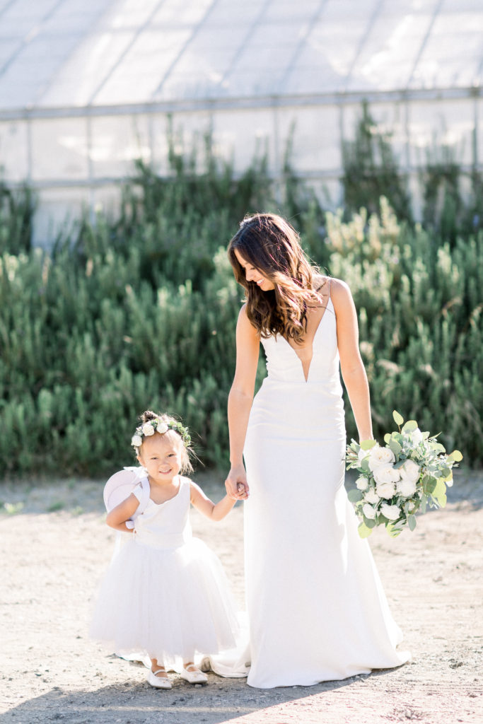 A classic greenhouse wedding at Dos Pueblos Orchid Farm, bride with ring bearer