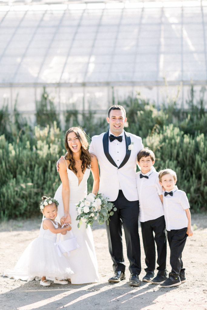 A classic greenhouse wedding at Dos Pueblos Orchid Farm, bride and groom with flower girl and ring bearers