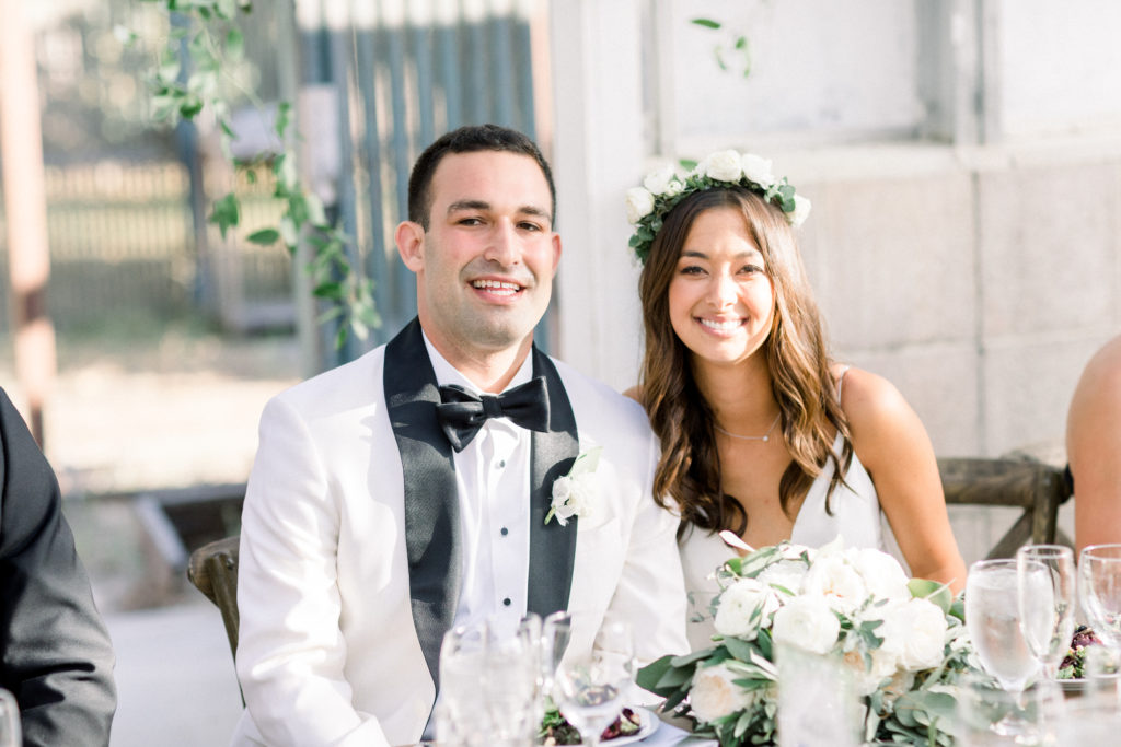 A classic greenhouse wedding reception at Dos Pueblos Orchid Farm, bride and groom