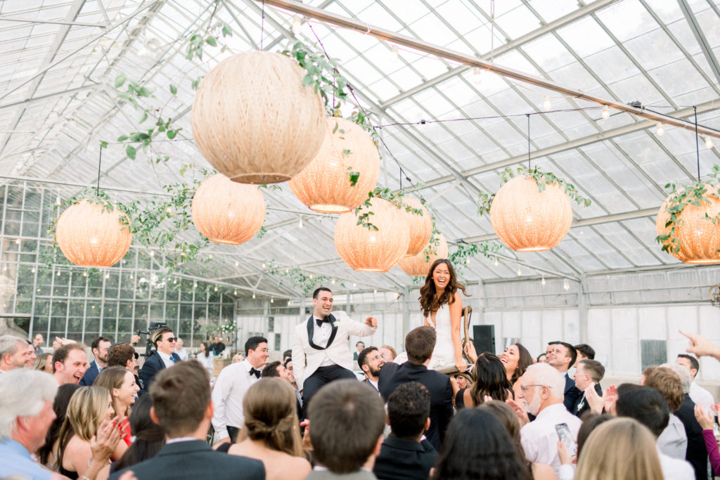 A classic greenhouse wedding reception at Dos Pueblos Orchid Farm, hora dance