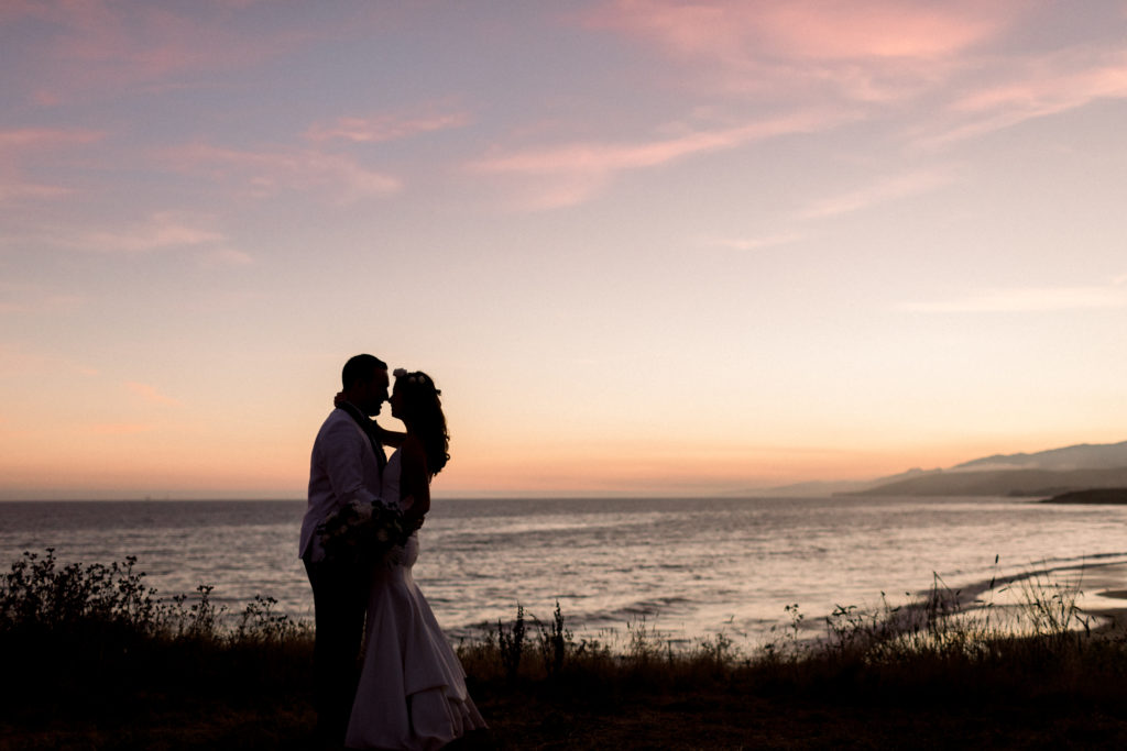 A classic greenhouse wedding reception at Dos Pueblos Orchid Farm, bride and groom sunset beach portrait shot