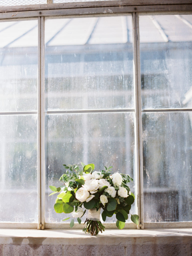 A classic greenhouse wedding at Dos Pueblos Orchid Farm, simple and classic green and white bridal bouquet