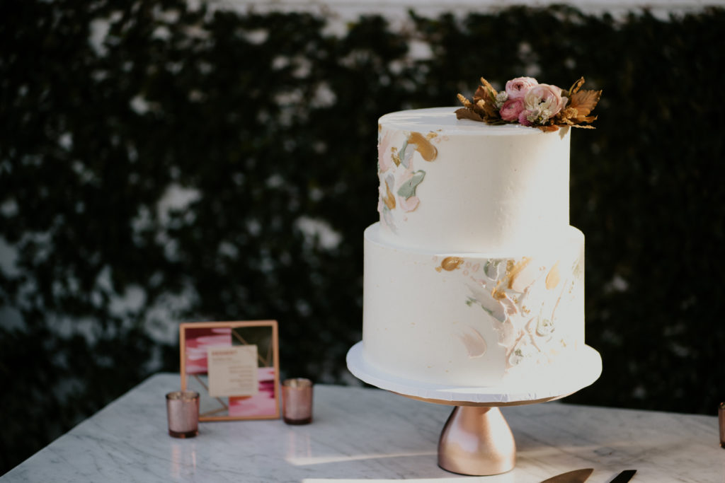 A whimsical wedding reception at Triunfo Creek Vineyards, watercolor wedding cake