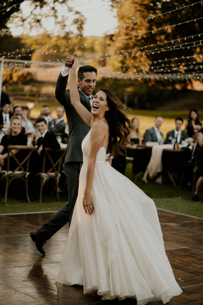 A whimsical wedding reception at Triunfo Creek Vineyards, bride and groom first dance