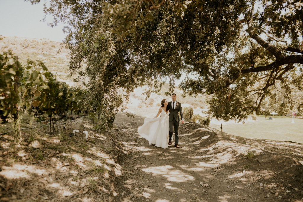 A whimsical wedding at Triunfo Creek Vineyards, bride and groom romantic portrait shot
