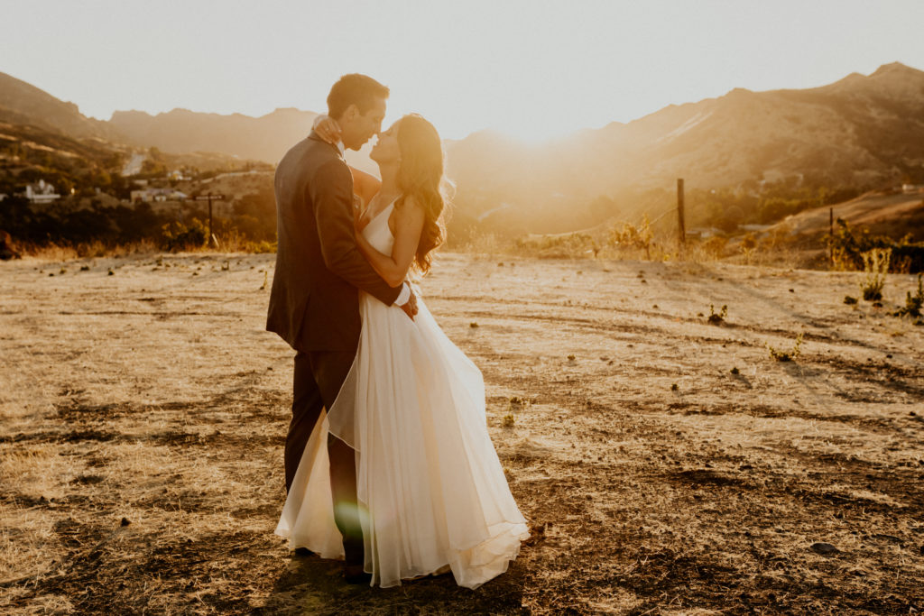 A whimsical wedding at Triunfo Creek Vineyards, sunset bride and groom portrait