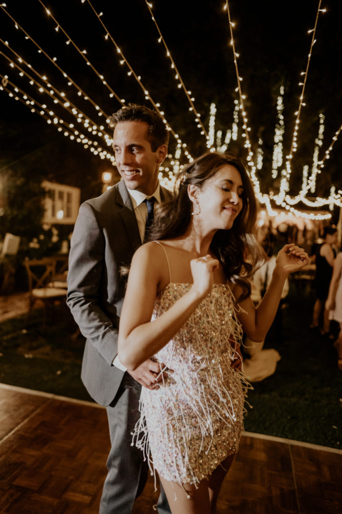 A whimsical wedding reception at Triunfo Creek Vineyards, bride and groom dance