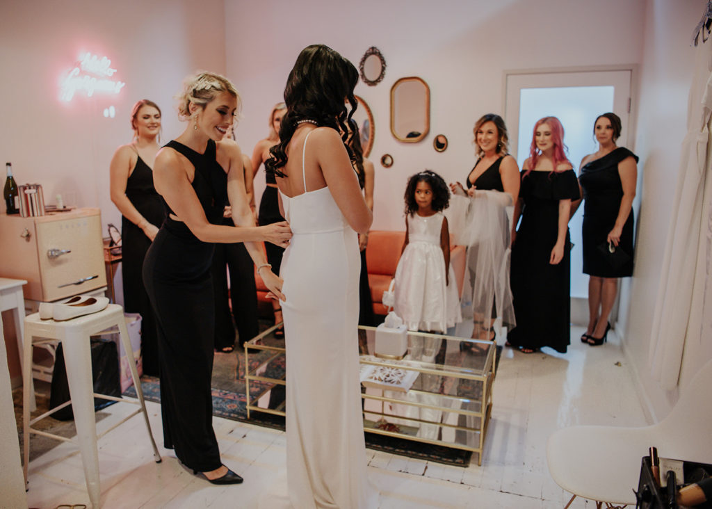 Beautiful wedding at The Unique Space in downtown LA, bride getting ready in pink bridal suite