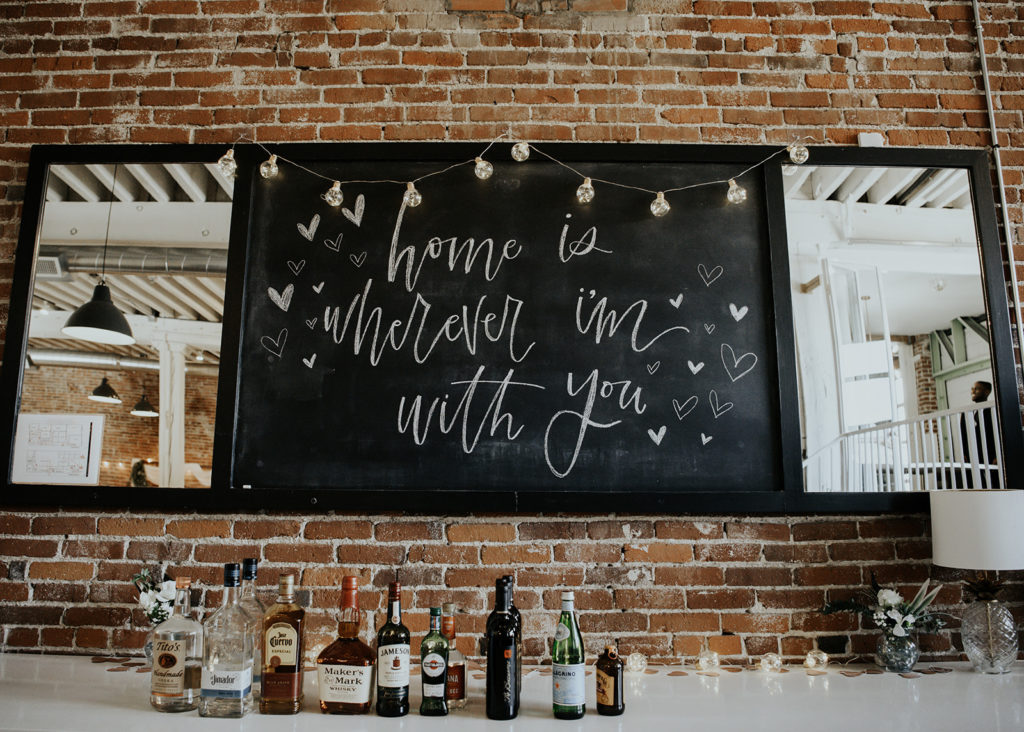 Beautiful wedding at The Unique Space in downtown LA, chalkboard love sign