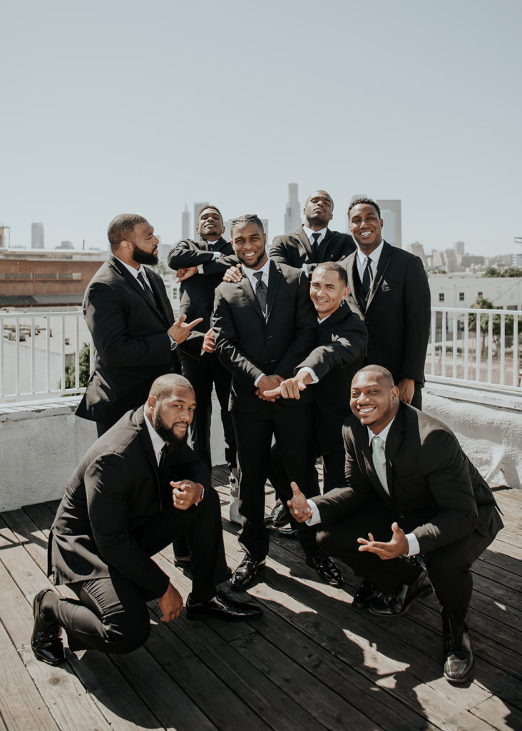 Beautiful wedding at The Unique Space in downtown LA, groomsmen in black suits