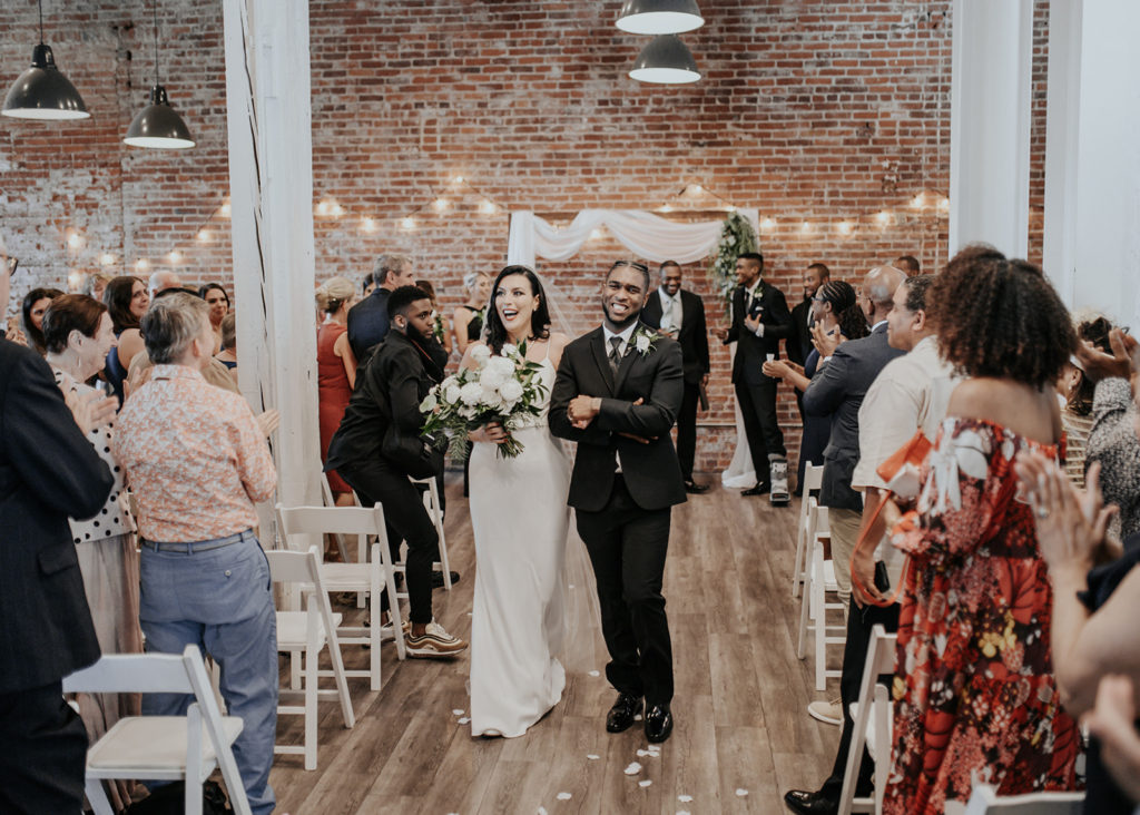 Beautiful wedding at The Unique Space in downtown LA, bride and groom recessional 