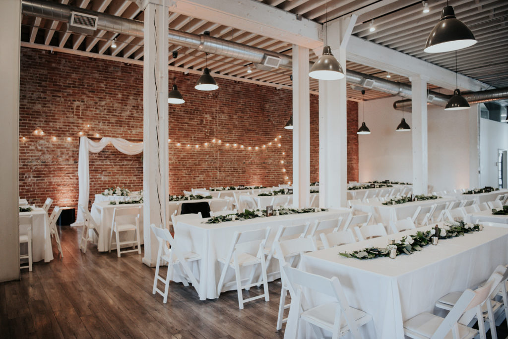 Beautiful wedding at The Unique Space in downtown LA, reception with white tablecloths 