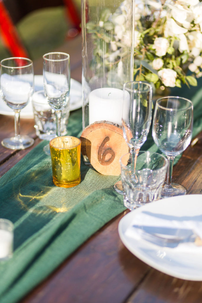 A Romantic Forest Inspired Wedding outdoor reception at the 1909, wood slice table number 