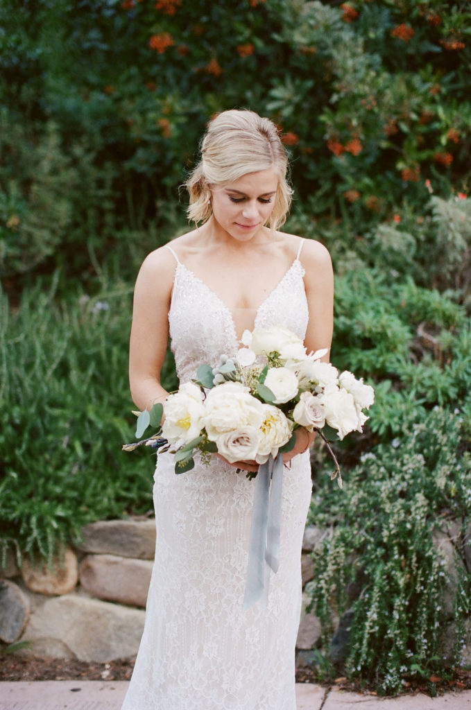 A Romantic Forest Inspired Wedding at the 1909, bridal portrait shot with green and white bridal bouquet