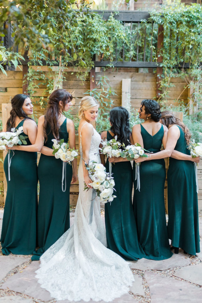 A Romantic Forest Inspired Wedding at the 1909, wedding party photo with emerald bridesmaid dresses