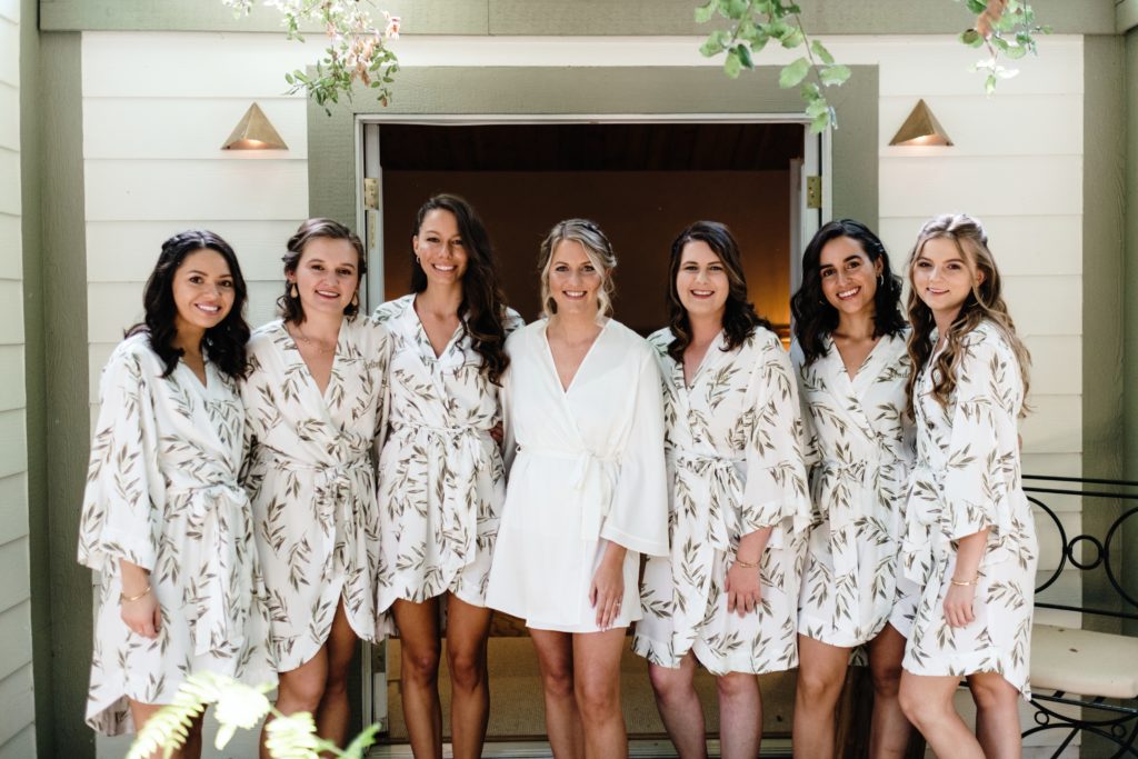A Classic Vineyard Wedding at Triunfo Creek Vineyards, bride getting ready with bridesmaids in robes