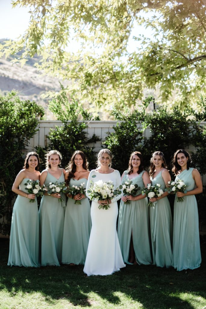 A Classic Vineyard Wedding at Triunfo Creek Vineyards, bride with bridesmaids in sage green dresses