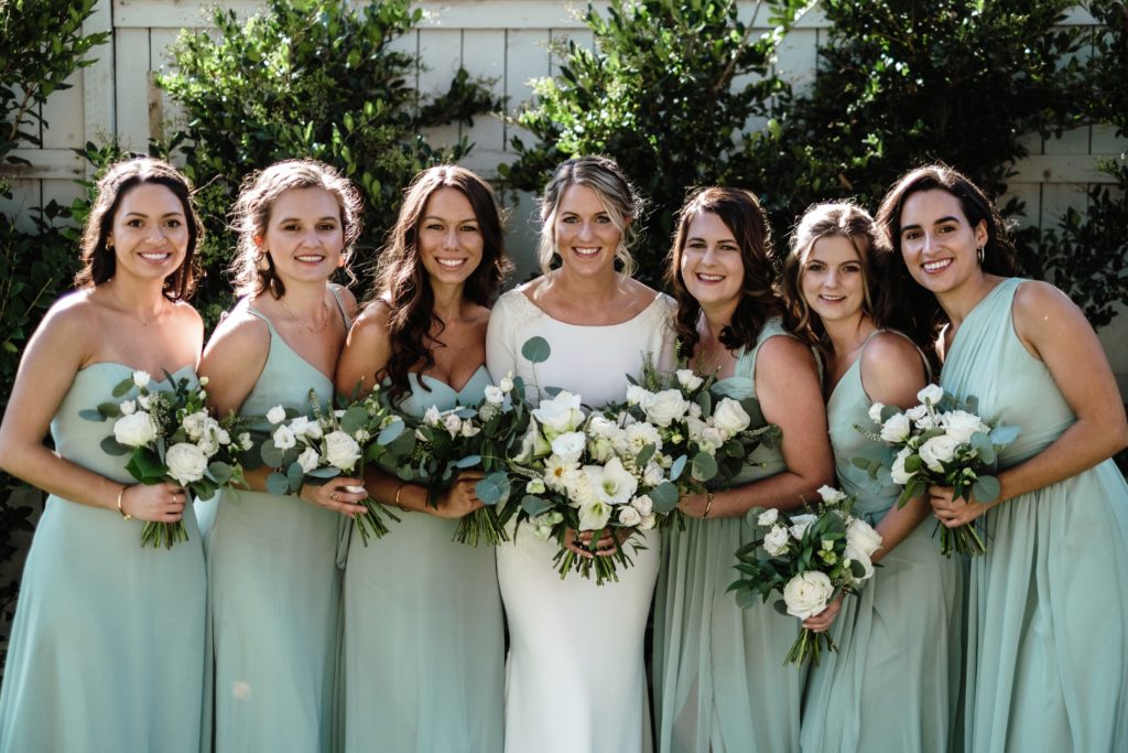 A Classic Vineyard Wedding at Triunfo Creek Vineyards, bride with bridesmaids in sage green dresses
